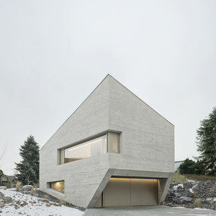 Mittelgroßes, Graues, Zweistöckiges Modernes Einfamilienhaus mit Betonfassade und Pultdach in Stuttgart