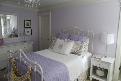 Example of a large transitional girl carpeted kids' room design in Other with purple walls