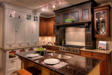 Eat-in kitchen - mid-sized traditional l-shaped travertine floor eat-in kitchen idea in Albuquerque with a double-bowl sink, raised-panel cabinets, dark wood cabinets, granite countertops, white backsplash, subway tile backsplash, stainless steel appliances and an island