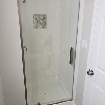 Two Bathroom Renovations and Custom Closet Shelving with Custom Tile Showers