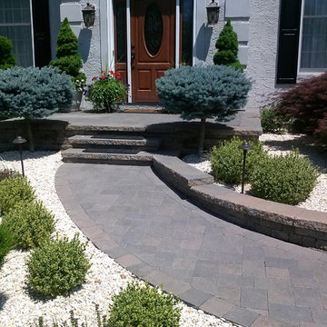 Paver Walkways and Pool Deck with Stone Veneer Retaining Wall