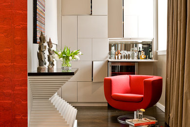 Family room - contemporary dark wood floor family room idea in Boston with beige walls