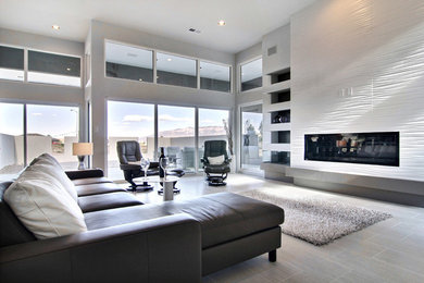 Example of a large trendy open concept and formal porcelain tile living room design in Albuquerque with white walls, a ribbon fireplace, no tv and a tile fireplace