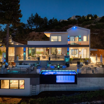 A little farm below a hillside resort-style off-the-grid view home