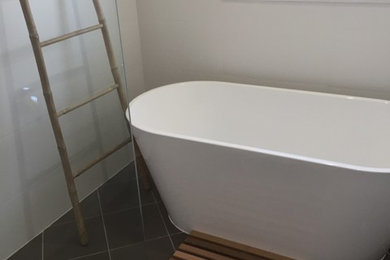 This is an example of a large modern bathroom in Canberra - Queanbeyan.