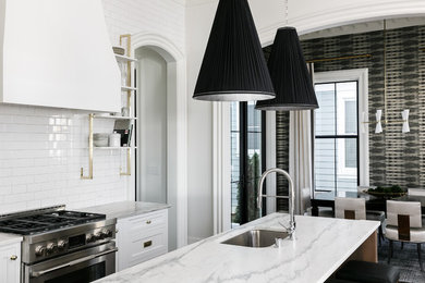 Large transitional l-shaped medium tone wood floor and brown floor eat-in kitchen photo in Louisville with an undermount sink, beaded inset cabinets, white cabinets, marble countertops, white backsplash, subway tile backsplash, stainless steel appliances and an island