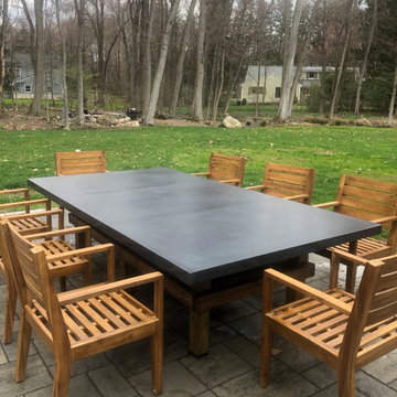 Franklin Lakes residence outdoor concrete table.