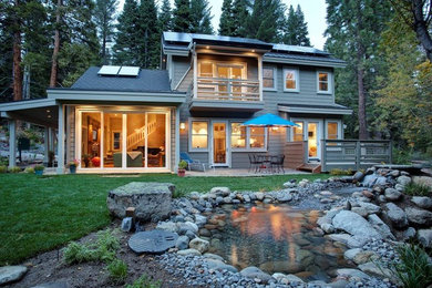 Mid-sized craftsman beige two-story mixed siding exterior home idea in Sacramento with a metal roof