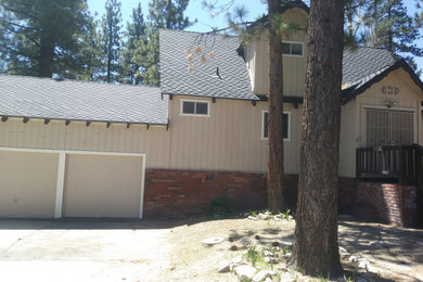 Home design - large rustic home design idea in Los Angeles