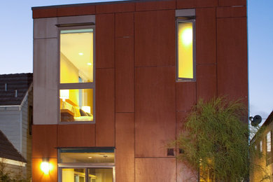 Inspiration for a contemporary red two-story exterior home remodel in Los Angeles