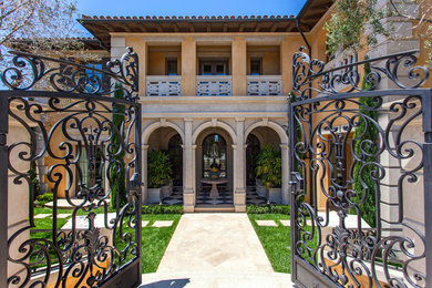 Tuscan two-story mixed siding house exterior photo in Orange County with a tile roof