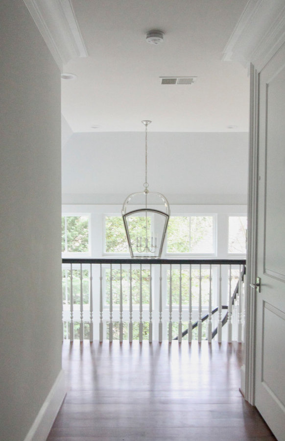 Powerful Impression by Floating Staircase in Suburban Foyer