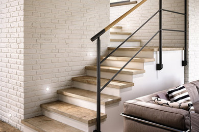 Ejemplo de escalera en L moderna de tamaño medio con escalones de madera, contrahuellas de madera y barandilla de metal