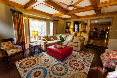 Inspiration for a large timeless open concept dark wood floor and brown floor living room remodel in Kansas City with beige walls, a standard fireplace, a brick fireplace and a tv stand