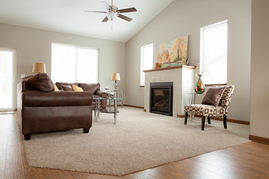 Living room - mid-sized traditional open concept carpeted and beige floor living room idea in Other with beige walls, a standard fireplace, a tile fireplace and no tv