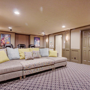 Large classic enclosed home cinema in Kansas City with beige walls, carpet, a wall mounted tv and multi-coloured floors.