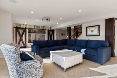 Example of a large farmhouse walk-out carpeted and beige floor basement design in Milwaukee with beige walls, a standard fireplace and a stone fireplace