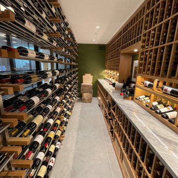 Custom Glass Wine Room with Traditional Walk-in Cellar with a Metal Wine Rack