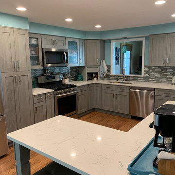 kitchen remodel--gray cabinets with white quartz and new splash