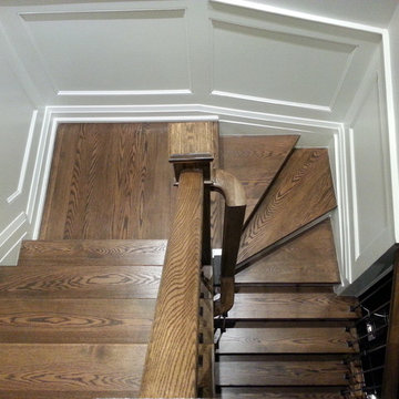 Espresso Stained Oak Staircase w/ Wainscoting, doors & trim
