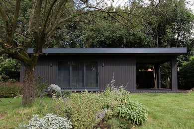 This is an example of a modern garden shed and building in Other.