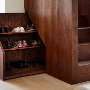 Contemporary wood staircase in London with wood risers.
