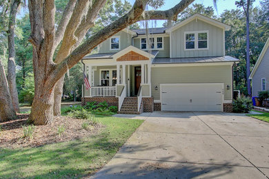 Example of an arts and crafts exterior home design in Charleston
