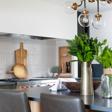 Charcoal Soapstone Countertop and Rift Oak Cabinets Merge in Stunning Kitchen
