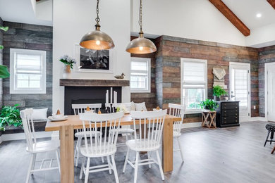 Example of a mid-sized eclectic light wood floor and gray floor kitchen/dining room combo design in San Diego with white walls and no fireplace