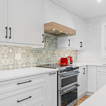 Serene Blue Oasis: Kitchen Renovation with White Perimeter and Meditation-Inspir