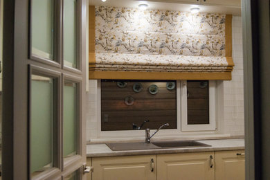 This is an example of a transitional kitchen in Saint Petersburg.