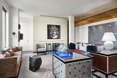Example of an eclectic enclosed dark wood floor living room design in New York with beige walls