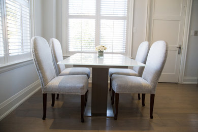 Example of a trendy dining room design in Toronto