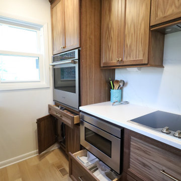 Rich & Refined: Custom Walnut Kitchen Remodel with White Quartz & Oak Flooring