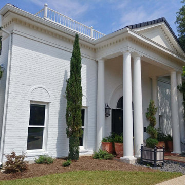 Grand Home with White Painted Brick Exterior