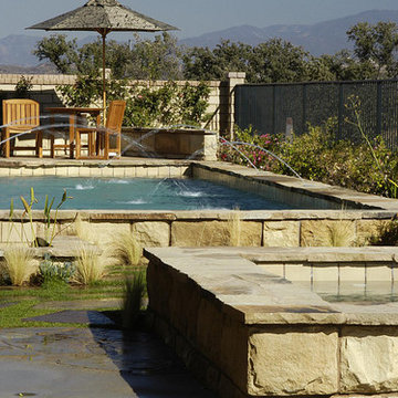 Mediterranean Stone Pool With Fountains