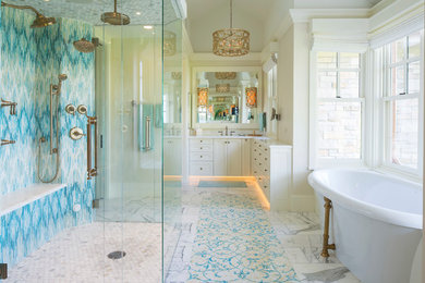 Elegant master blue tile, multicolored tile and white tile marble floor bathroom photo in Minneapolis with white cabinets and beige walls