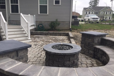 Design ideas for a patio in Other with a fire feature and natural stone paving.