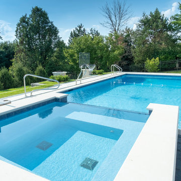 Burr Ridge Lap Pool with Raised Hot Tub and Waterfall