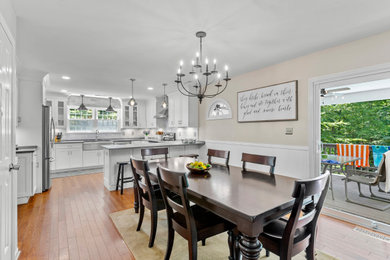 Kitchen/dining room combo - mid-sized traditional medium tone wood floor and brown floor kitchen/dining room combo idea in DC Metro