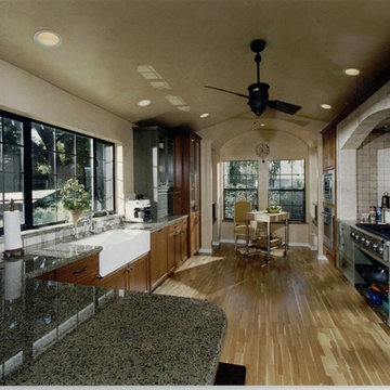Kitchen with a unique designed alcove with rustic cabinets