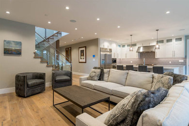 Inspiration for a craftsman open concept living room remodel in Vancouver with a stone fireplace
