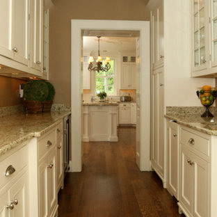 Large traditional kitchen pantry ideas - Large elegant galley medium tone wood floor kitchen pantry photo in Louisville with shaker cabinets, beige cabinets, granite countertops, stainless steel appliances and an island