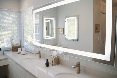 Example of a large transitional master white tile and porcelain tile porcelain tile, white floor and double-sink bathroom design in San Francisco with flat-panel cabinets, white cabinets, a bidet, white walls, an undermount sink, quartz countertops, gray countertops and a built-in vanity