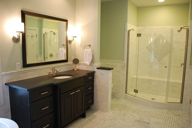 Bathroom - mid-sized traditional master white tile and stone tile mosaic tile floor bathroom idea in Richmond with an undermount sink, green walls, dark wood cabinets, a one-piece toilet, flat-panel cabinets and solid surface countertops