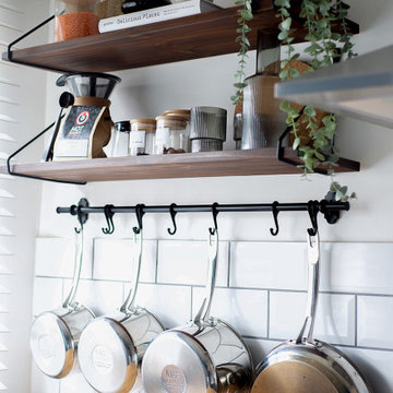Open shelving in Cambridge galley kitchen