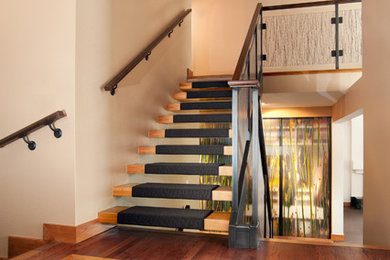 Mid-sized transitional wooden open staircase photo in Denver