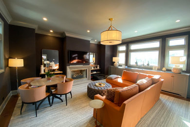 Living room - large traditional formal and enclosed medium tone wood floor, brown floor and wallpaper living room idea in Chicago with blue walls, a standard fireplace, a stone fireplace and a wall-mounted tv