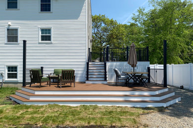 Trendy backyard metal railing deck photo in Boston