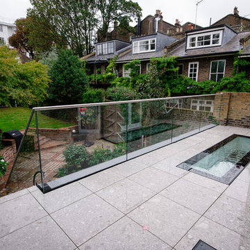 External Open Riser stairs with perforated treads and glass balustrade